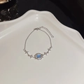 Saturn charm bracelet in S925 silver with blue stones and sparkling star pendants - S238 Silver