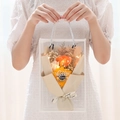 Orange soap rose bouquet in transparent gift bag with LED lights and handle - 3-Flower Box [Champagne Rose + Sunflower] + Light + Card