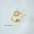 Detail showing pink natural stone ring dimensions 1cm stone and 2cm width gold band - White Jade