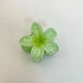 Translucent green plumeria flower hair claw clip for women on a beige fabric background - Frangipani Hair Clip / 6x5x3.8CM / Light Green