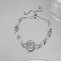 Adjustable beaded bracelet with moonlight stones and silver star charms on reflective surface - Silver Moonstone Star