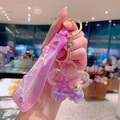 Pink floral astronaut liquid sand keychain with silicone strap and shell charms - Purple Ocean Starfish Quicksand