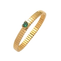 Macro shot of flexible gold bracelet featuring a vibrant heart-shaped emerald green zircon - Bracelet-Emerald Green
