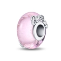 Detailed macro view of pink glass charm bead with silver core featuring Queen engraving - Glamour Queen Pink Purple (Luminous)