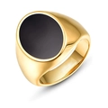 Detail of a polished gold men's ring with a smooth black oval resin stone inlay - Gold Oval