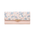 Detail of light pink floral wallet featuring gold metal trim and Lucky brand engraving - Pink