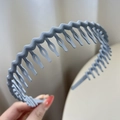 Greyish blue matte plastic headband with wavy non-slip teeth for secure hair styling - Blue Grey
