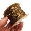 Close-up of 1mm golden brown metallic braided cord wrapped on a cardboard spool - Approx. 1.2mm 40m / Coffee