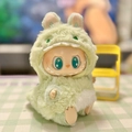 Plush Labubu doll wearing a light green monster outfit from the party series - 3d Green Dinosaur Pendant / First And Second Generation Keychains Are Compatible With La Cloth Dolls. Dolls Not Included.