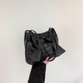 Large black bow shoulder bag in smooth faux leather with spacious minimalist design - Black
