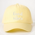 Detail of Good Vibes white embroidery on a yellow cotton canvas baseball cap - Goose Yellow