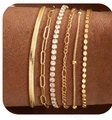 Layered gold cuban link bracelet set for women featuring butterfly and crystal accents - Gold Layered Set - Includes Zirconia/Figaro