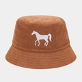 Close-up of caramel bucket hat featuring a white horse embroidery and knit texture - One Size / Tan