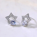 Star-shaped silver earring with clear round zircon stones and fine inlay details - Star