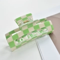 Detail shot of green and beige checkered hair claw clip with golden metal spring - Green/White Plaid Rectangle