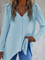 Detail of light blue V-neck knit top with unique irregular hem and vertical texture - Blue