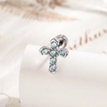 Silver cross earring with micro-pave blue zircon stones on a white stand - Cross (A718-3) / Light Blue (Single)