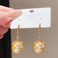 Close-up of golden pearl earrings with leaf diamond accents on S925 silver needles - Gold (39# Ear Hook)