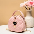 Pink quilted circular shoulder bag with a cat charm and golden chain handle - Pink