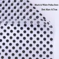 Close-up of translucent gold polka dot floral wrapping paper with 0.7cm black dots - White Black Small Dots
