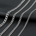 Detail of four different widths of silver stainless steel Cuban link chains on black leather - 4mm-45cm / Steel