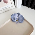 Elegant blue phalaenopsis orchid hair clip with a pearl center on a ceramic tray - Gray Blue
