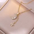 Gold moon and star necklace with rectangular zircon accents on a soft jewelry box - X0184 Star and Moon Pendant