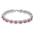 Detail of silver link bracelet with oval red halo gemstones and crystal accents - Platinum Red Zirconia
