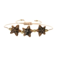 Detailed macro view of woven starfish bracelet with ceramic beads and gold spacers - Copper Beads + Dark Brown Starfish