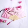 Pink folding fan with cherry blossoms and bamboo ribs featuring a silk tassel - Pink Cherry Blossom & Butterfly Style (Yixiao Women's Fan-16)