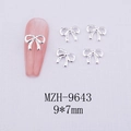 Detail of silver alloy bow nail art charms with size 9x7mm on pink manicured tips - Silver Bowknot-9643
