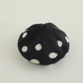 Top-down view of knitted polka dot beret featuring classic black and white wool texture - 2-4 years old / Black