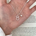 Minimalist silver butterfly necklace with hollow bear pendant shown on palm - Bear Bead Pendant Necklace (XL3286)