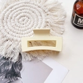 Detail of a matte beige rectangular hair claw clip on a white decorative coaster - Medium Matte Square Claw-Cream White