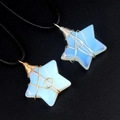 Star-shaped opal pendants wrapped in gold and silver wire on black cords - Opal (Synthetic)