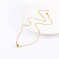 Minimalist 18K gold plated stainless steel bead necklace with adjustable chain on white ceramic - 6mm Gold Lucky Bead