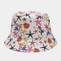 Detailed view of colorful starfish and seashell prints on white cotton bucket hat fabric - Colorful Starfish and Shell Style