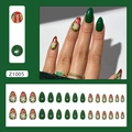Christmas almond nails with dark green finish, red bow accents and golden glitter - Z1005 Christmas Gift Box Style (With Glue)
