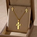 Detailed view of golden Jesus cross necklace and earrings set in a brown jewelry box - JESUS Cross (TZ-463)