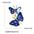 Détail de la broche papillon en émail bleu avec dimensions 3,3cm et poids de 6g - Bleu