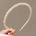 Elegant white pearl headband for girls featuring uniform pearls and a slim frame design - Style 14 Pearl Headband