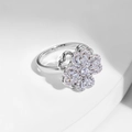 Rotating four-leaf clover ring with sparkling zircon inlays on a silver metal band - Silver