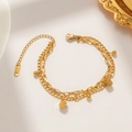 Golden double-layered stainless steel bracelet featuring round and square chain links - Gold
