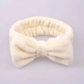 Soft cream white plush headband with large bow for facial cleansing and makeup tasks - Off White