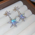 Macro shot of silver snowflake earrings with sparkling zircons on a white jewelry box cushion - Double Snowflake Dangle Style (4# Silver Earring Post - Silver)