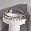 Two-tone silver and gold stainless steel chain link bracelet on a concrete stand - Two-Tone Gold/Silver 21cm Length 1.1cm Width