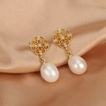 Macro detail of 18K gold-plated earrings with freshwater pearls and purple zircon stones - ER1469-A Purple Zircon Hollow Oval Pearl
