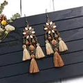 Detail of bohemian long tassel earrings with wooden beads and earthy floral accents - Enamel Tassel (H3654)
