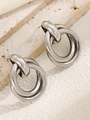 Minimalist silver knotted hoop earrings made of metal on beige textured stone background - Shiny Knot Circle Silver (6513)
