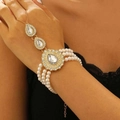 Elegant gold-tone bracelet with white imitation pearls and clear oval crystal settings - KC Gold (H-57)